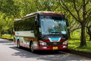 A 5-star luxury day cruise sailing through Ha Long Bay emerald waters on a day trip from Hanoi.